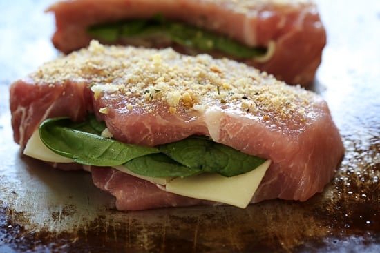 These stuffed pork chops are SO good, inspired my a meal I had a few nights ago at a local Italian restaurant. Stuffed with prosciutto, mozzarella and baby spinach then topped with garlic and breadcrumb.
