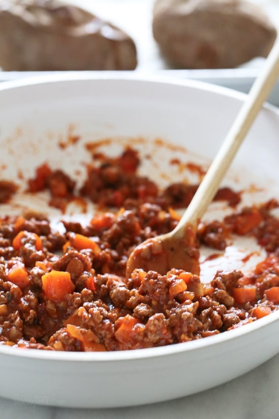 Swapping bread for baked sweet potatoes makes eating a Sloppy Joe so much healthier! This savory-sweet dish is gluten-free, dairy-free, whole30 and Paleo.