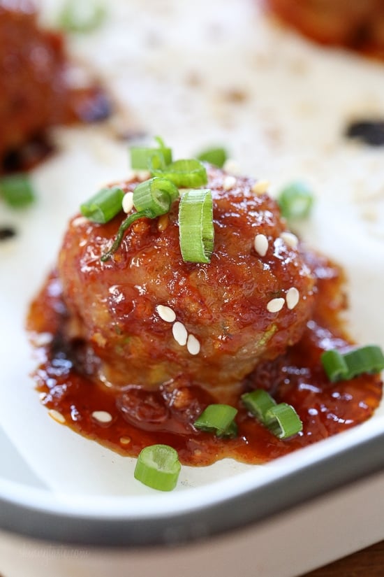 These Asian inspired turkey meatballs are seasoned with ginger and spices and finished with a sweet and spicy, gochujang glaze. Great as an appetizer or serve them with brown rice to make them a meal.