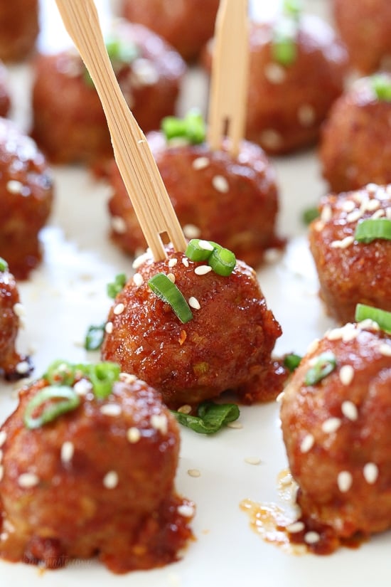 These Asian inspired turkey meatballs are seasoned with ginger and spices and finished with a sweet and spicy, gochujang glaze. Great as an appetizer or serve them with brown rice to make them a meal.