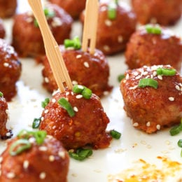 These Asian inspired turkey meatballs are seasoned with ginger and spices and finished with a sweet and spicy, gochujang glaze. Great as an appetizer or serve them with brown rice to make them a meal.
