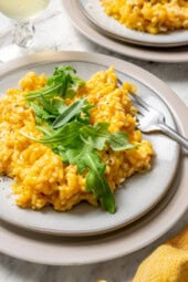 Plate of butternut squash risotto with fork