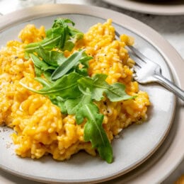Plate of butternut squash risotto with fork