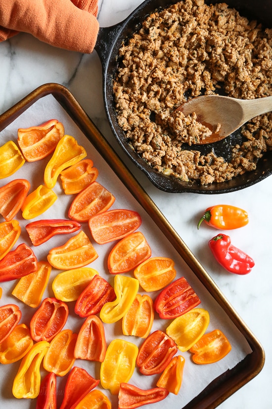 Loaded mini bell pepper nachos – game changer!! These low-carb nachos are loaded with turkey taco meat, cheese and all your favorite nacho toppings!