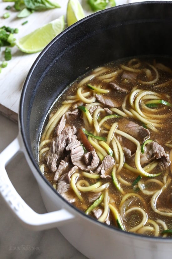 A quick, flavorful Vietnamese-inspired nood-less pho subs zucchini for rice noodles. So easy, the steak is sliced thin and cooks less than a minute in the ginger-garlic beef broth. Top this with fresh lime, basil, cilantro, jalapeno and scallions and you have one tasty faux pho!