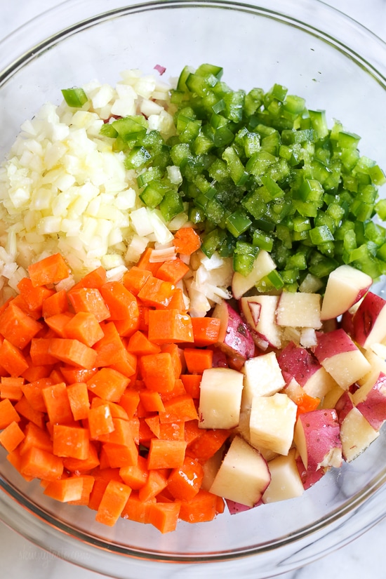 Homemade breakfast potatoes made with red potatoes, onions, bell pepper and carrots all on one sheet pan. All you need is some eggs and breakfast is served!