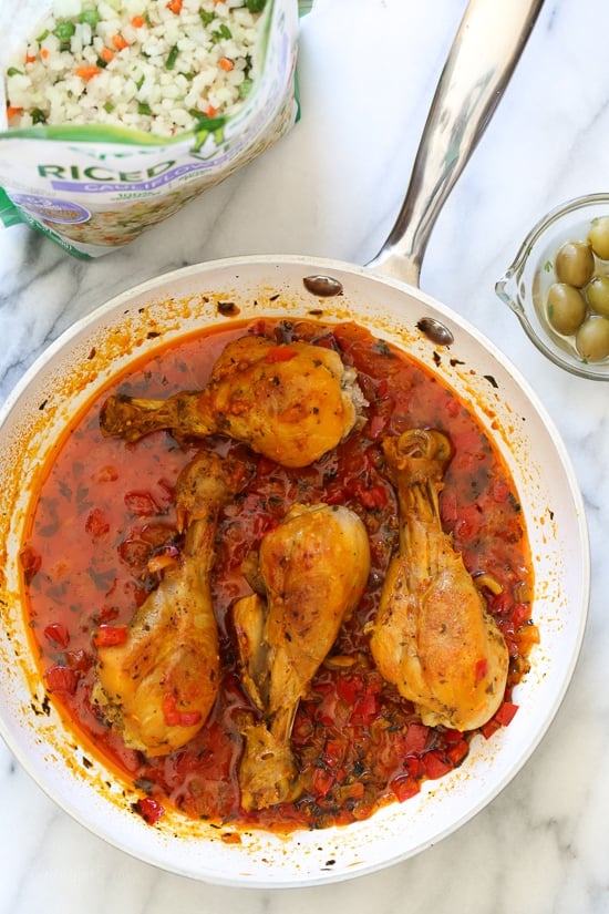 Spanish chicken and rice, a dish I grew up eating, is pure comfort food to me. This low-carb version swaps the rice for veggies, which means larger portions with 85% less calories than rice!