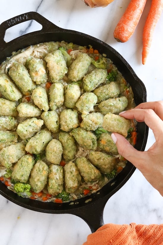 Skillet Chicken and Broccoli Veggie Tot Pie is the ultimate fast and easy, family-friendly, one-pan comfort dish! Made in a skillet with chicken breast, celery, carrots, and broccoli, then finished in the oven with broccoli and cheese veggie tots.