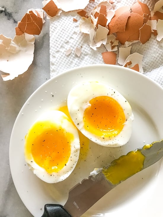 These Instant Pot Hard Boiled Eggs are ready in just 10 minutes and come out perfectly every time. Soft boiled eggs included too! A soft boiled egg cut in half on a plate