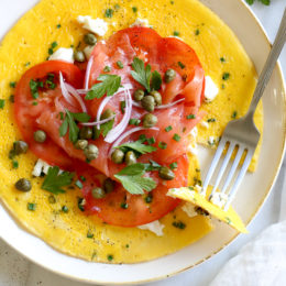This Goat Cheese Herb Omelet topped with Nova Lox, sliced tomatoes and capers satisfies my bagel-and-lox craving, without the bagel! SO quick, takes about 5 minutes to make!
