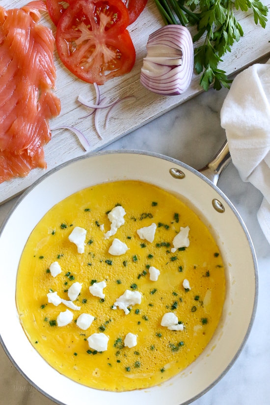 This Goat Cheese Herb Omelet topped with Nova Lox, sliced tomatoes and capers satisfies my bagel-and-lox craving, without the bagel! SO quick, takes about 5 minutes to make!