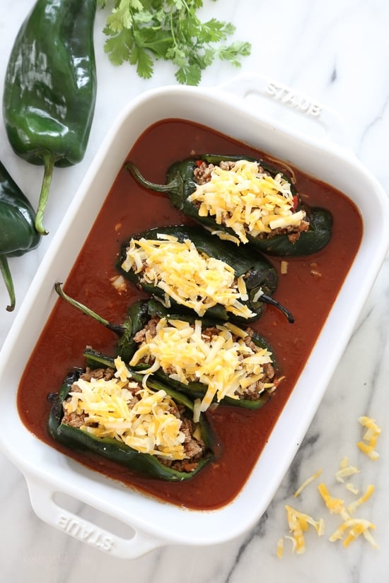 These baked Turkey Enchilada Stuffed Poblanos Rellenos are peppers stuffed with a flavorful ground turkey filling, topped with my homemade enchilada sauce and cheese.