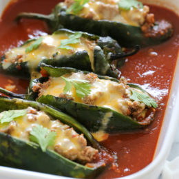 These baked Turkey Enchilada Stuffed Poblanos Rellenos are peppers stuffed with a flavorful ground turkey filling, topped with my homemade enchilada sauce and cheese.