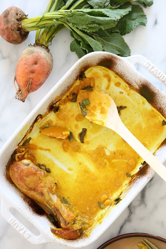 Turmeric Braised Chicken with Golden Beets and Leeks is layered with spices, covered with wine and baked in a casserole dish. What emerges from the oven once it's done is the most incredible tasting chicken dish in a rich, golden broth with the perfect balance of flavors that will make you want to lick the bottom of the dish, it's THAT good!