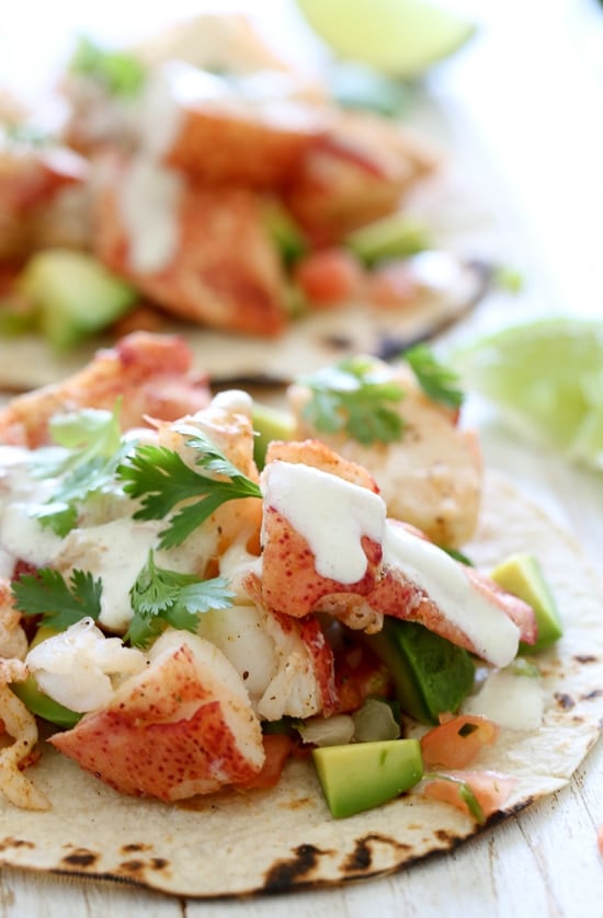 These lobster tacos are made with steamed chunks of lobster meat, avocado and pico de gallo, topped with a spicy poblano crema. If you want to step up your fish taco game, you need these in your life!