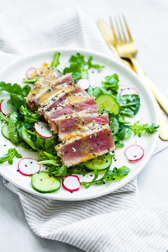 This panko and sesame crusted seared tuna on a bed of arugula and spinach salad, all topped with a wasabi butter sauce, takes Japanese food to whole new level!