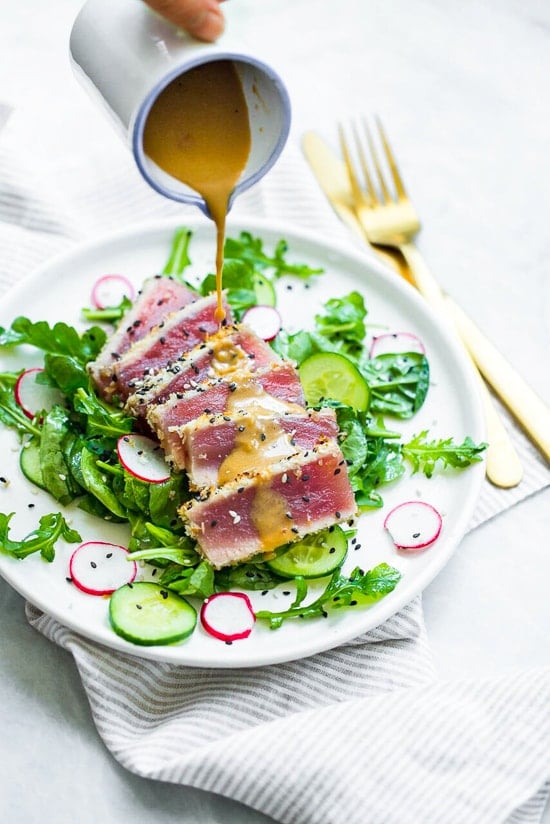 This panko and sesame crusted seared tuna on a bed of arugula and spinach salad, all topped with a wasabi butter sauce, takes Japanese food to whole new level! 