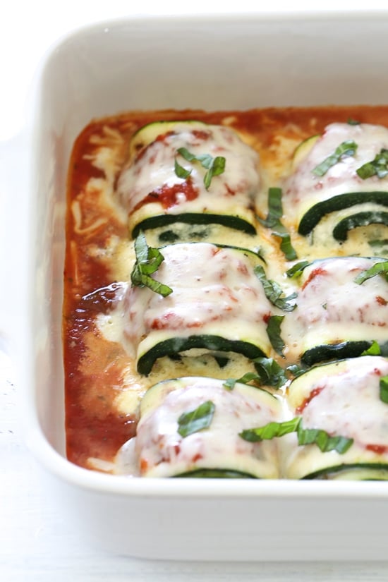 Zucchini Rollatini is low-carb and delicious! Made with strips of grilled zucchini stuffed with a basil-cheese filling, then rolled and topped with marinara, mozzarella and baked in the oven until the cheese is hot and melted.