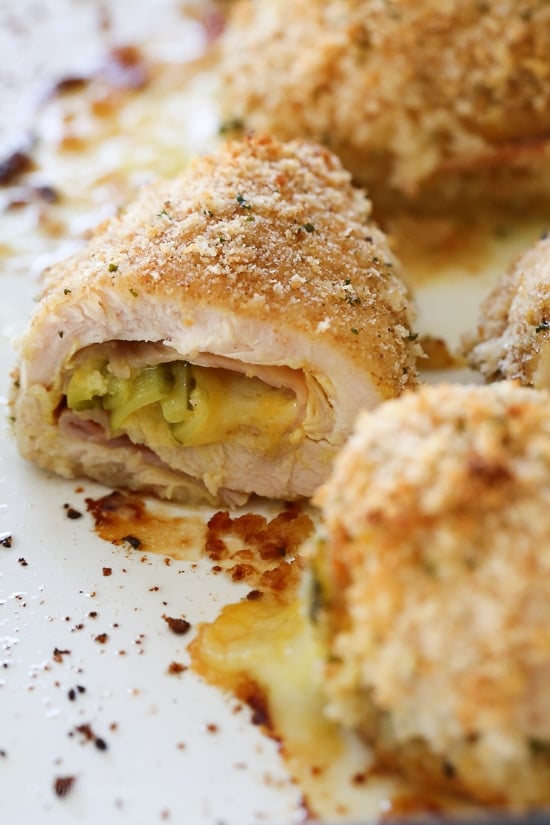 This Cubano Chicken Roll Up idea came to me after having a serious pickle craving! I wanted to make a hot dish utilizing dill pickles in some way and decided to stuff a chicken breast with everything you'd normally find in a Cuban Sandwich – pickles, mustard, Swiss, and ham. But I took it a step further and brined the cutlets overnight in pickle juice for extra flavor, the results were outstanding!!!