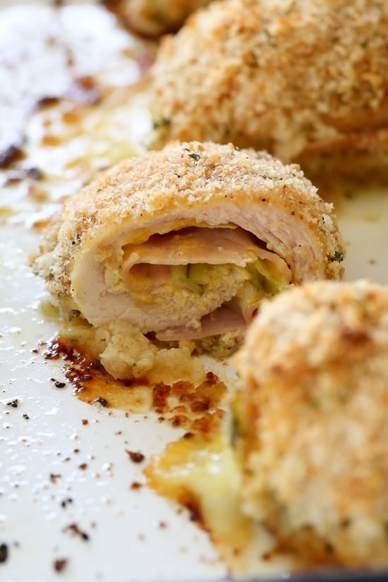 This Cubano Chicken Roll Up idea came to me after having a serious pickle craving! I wanted to make a hot dish utilizing dill pickles in some way and decided to stuff a chicken breast with everything you'd normally find in a Cuban Sandwich – pickles, mustard, Swiss, and ham. But I took it a step further and brined the cutlets overnight in pickle juice for extra flavor, the results were outstanding!!!