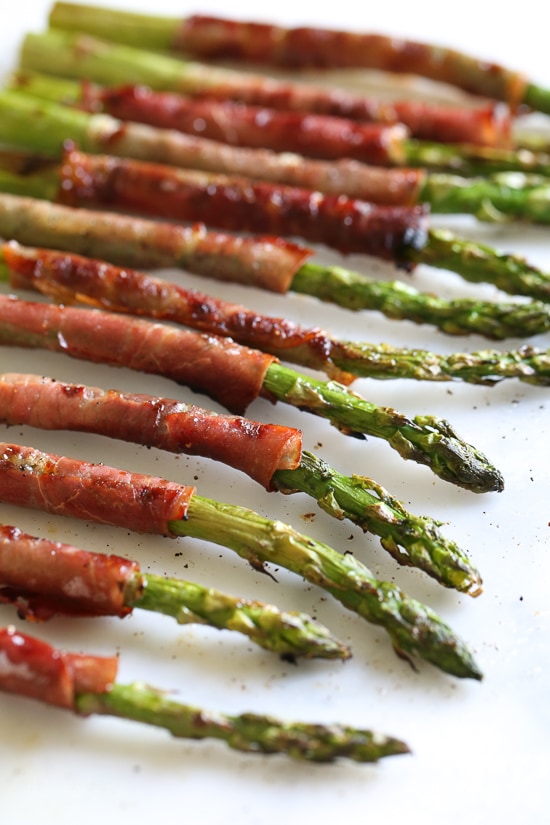 These Prosciutto Wrapped Asparagus, an easy 3-ingredient side dish, can be grilled outside or indoors if you have a grill pan. Perfect as a side dish, or as an appetizer (makes a great addition to your charcuterie platter!)