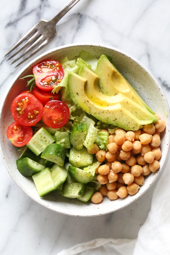 This Chickpea and Avocado salad is my go-to lunch when I need something fast and healthy! I load it up with garden vegetables and top it with a little olive oil and lemon, or olive oil and vinegar depending on my mood. Super simple, fresh and fills me up!