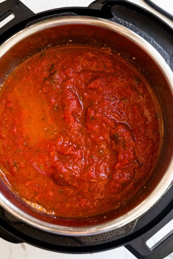 Add the water, pasta and marinara sauce