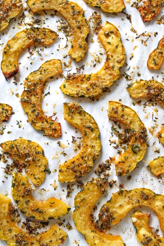 Roasted Delicata squash is delicious topped with a Parmesan-herb crust. The edges come out crisp, golden and delicious.