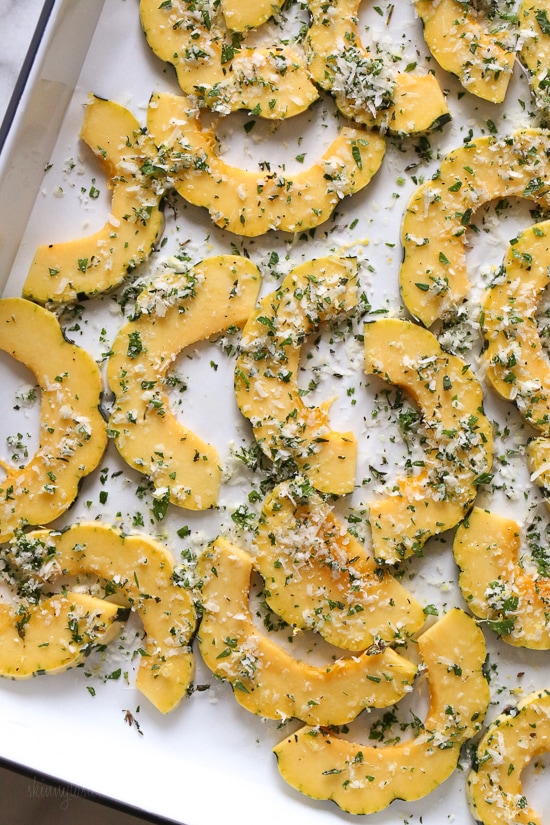 Roasted Delicata squash is delicious topped with a Parmesan-herb crust. The edges come out crisp, golden and delicious. Roasted Delicata squash topped with a Parmesan-herb crust.