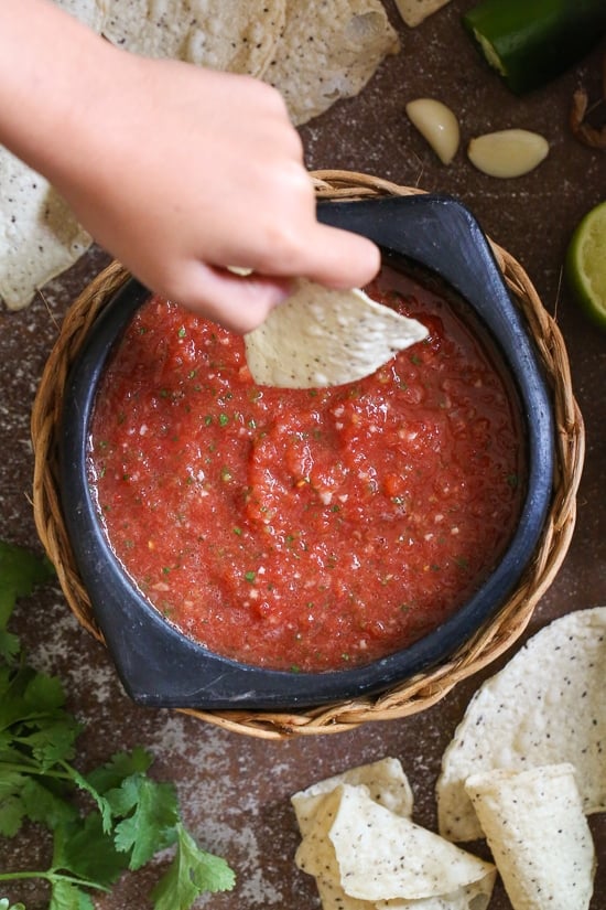 Get the chips ready for this quick and easy No-Cook Restaurant-Style Salsa recipe! In less than five minutes, you will have a delicious, healthy appetizer or snack everyone will love. It's bright, fresh and perfect for parties!