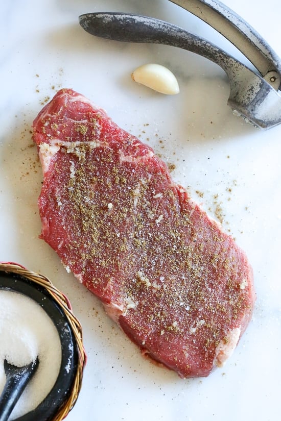I love a salad that fills you up and leaves you satisfied like this Carne Asada Salad made with Strip Steak topped with pico de gallo, Monterey Jack cheese and guacamole. This Carne Asada steak salad is made with everything I love – NY Strip Steak, pico de gallo, Monterey Jack cheese and guacamole. A salad that's low-carb and high in protein which fills you up and leaves you satisfied