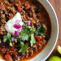 chili in a bowl with sour cream.