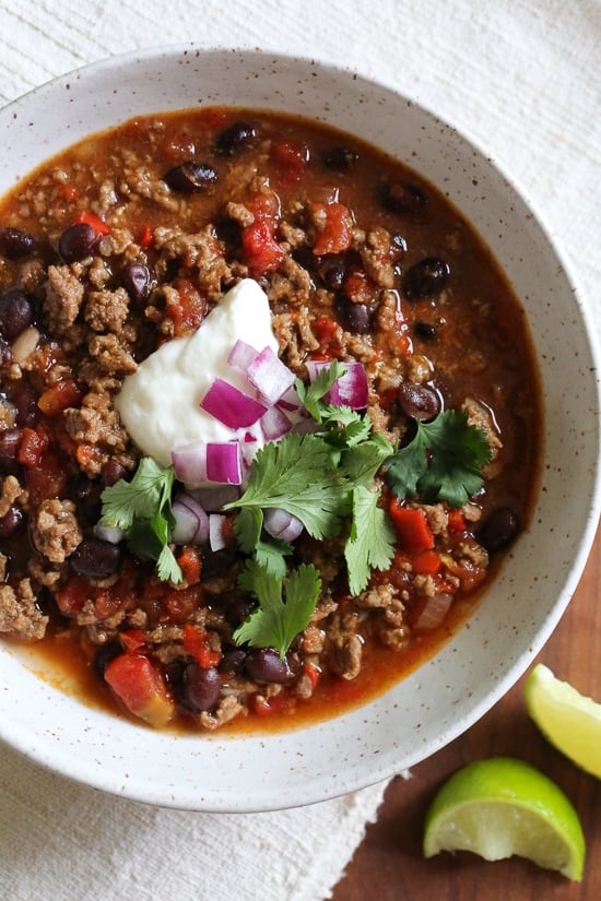 Hearty, filling, and ready in an hour, this is truly the best chili recipe! Made with beans, beef, and a blend of spices. I love this quick and easy beef chili made with black beans, tomatoes, homemade chili spices and beer. This chili pleases all the palates in my house – not to too spicy (although you can kick it up if you wish), loaded with flavor, and ready in less than 30 minutes.