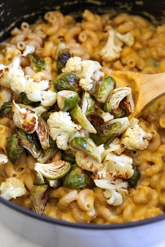 It's October, so Pumpkin Mac and Cheese with Roasted Cauliflower and Brussels Sprouts is a must for the Fall! Using pumpkin puree makes a creamy light cheese sauce, without having to add cream or too much cheese. You can make your own pumpkin puree or use organic canned pumpkin to make it faster!