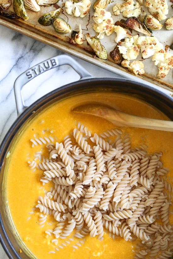 It's October, so Pumpkin Mac and Cheese with Roasted Cauliflower and Brussels Sprouts is a must for the Fall! Using pumpkin puree makes a creamy light cheese sauce, without having to add cream or too much cheese. You can make your own pumpkin puree or use organic canned pumpkin to make it faster!