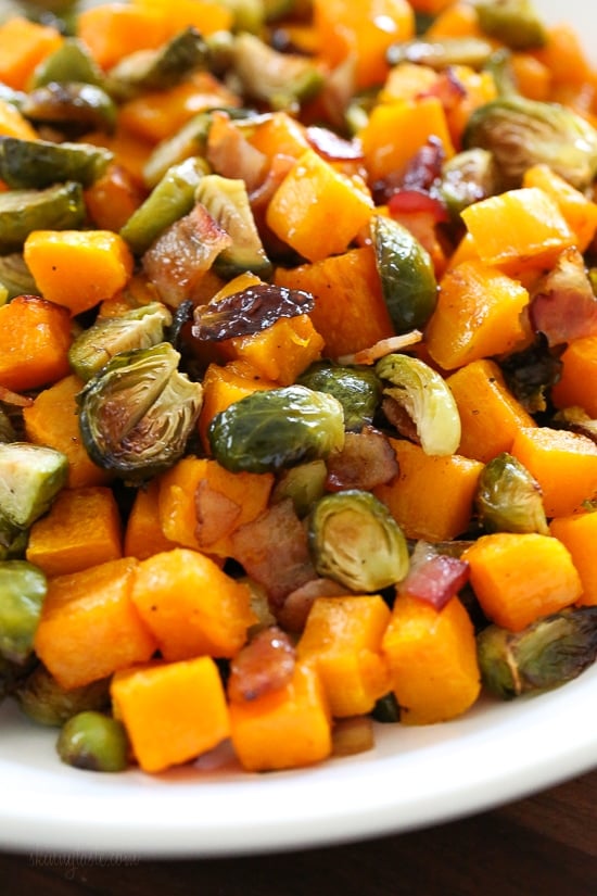 Roasted Brussels Sprouts and Butternut Squash are delicious on their own, but adding bacon and a maple soy glaze makes them over-the-top delicious! Made all on one sheet pan, you can double or triple this recipe to feed a crowd by adding more sheet pans.