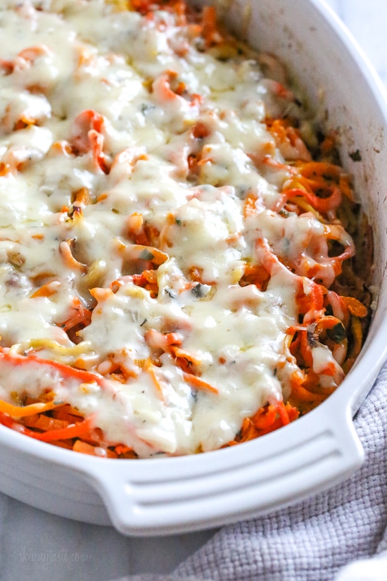 Spiralized Winter Veggie Gratin is the perfect holiday side dish! Made with spiralized vegetable gratin is made with sweet potatoes, butternut squash, carrots, and parsnips and topped with a white sauce and Gruyere cheese.