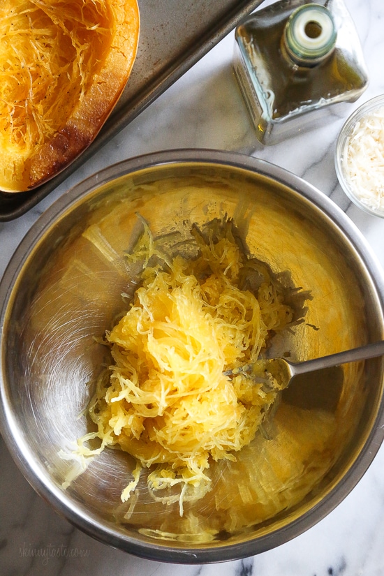 Roasted spaghetti squash with bacon and Parmesan cheese is a tasty recipe and easy side dish. Although there are several methods to cook spaghetti squash, my favorite way to make it is roasted. To roast the squash, I cut it on half lengthwise, remove the seeds and cook it cut down for about one hour.