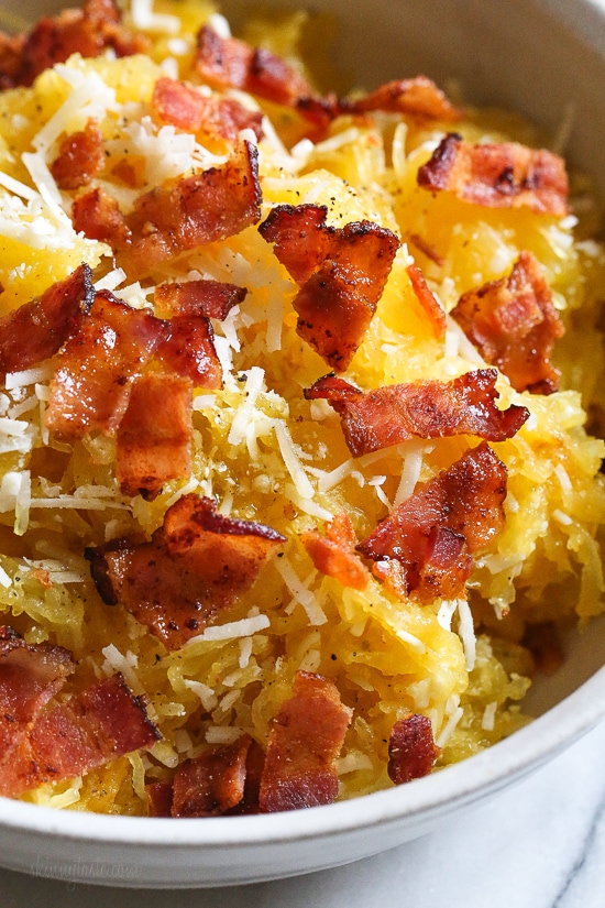 Roasted spaghetti squash with bacon and Parmesan cheese is a great way to top spaghetti squash for an easy, tasty, low-carb side dish. Although there are several methods to cook spaghetti squash, my favorite way to make it is roasted. To roast the squash, I cut it on half lengthwise, remove the seeds and cook it cut down for about one hour.