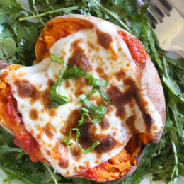 These savory stuffed sweet potatoes are topped with Italian flavors such as marinara sauce and mozzarella cheese. A quick and easy healthy vegetarian dish.