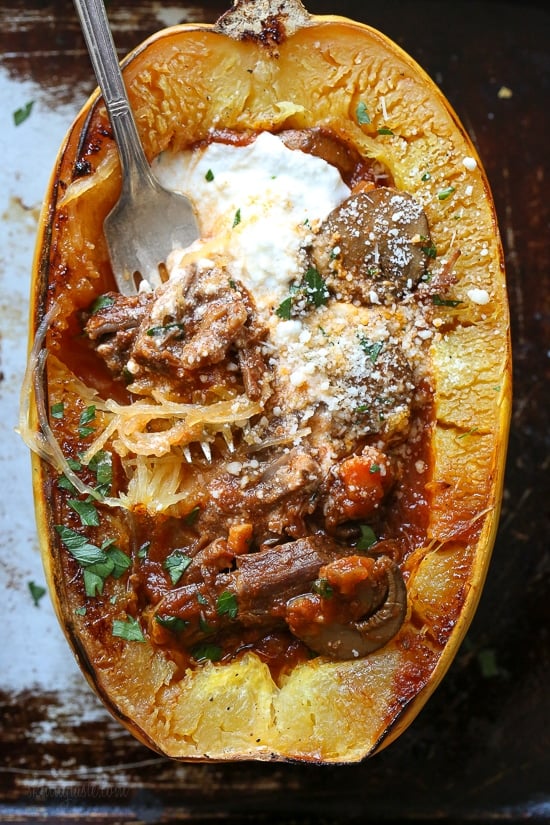 I swapped traditional pasta for roasted spaghetti squash to enjoy this cozy and delicious Beef and Mushroom Ragu served with a dollop of ricotta and grated Pecorino Romano – you won't miss the pasta!