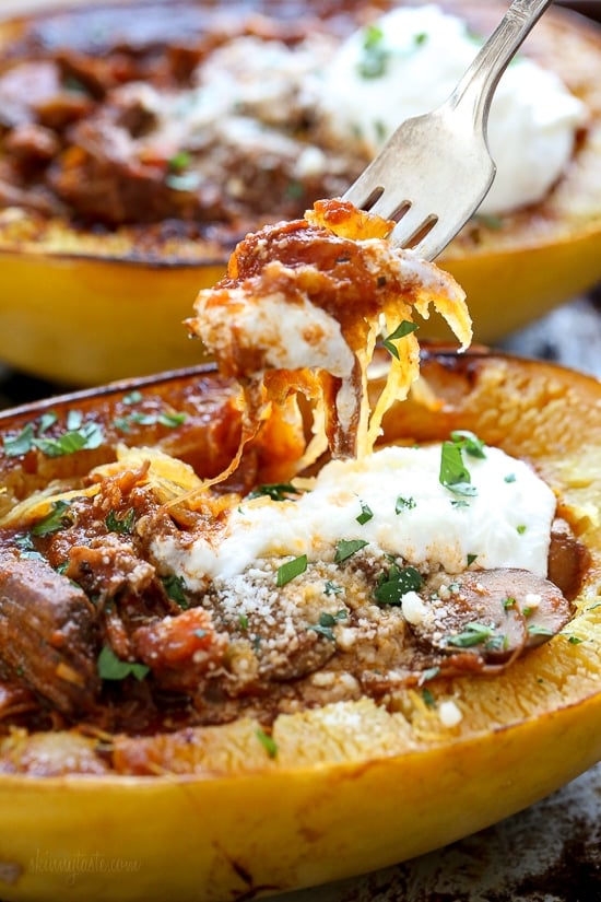 I swapped traditional pasta for roasted spaghetti squash to enjoy this cozy and delicious Beef and Mushroom Ragu served with a dollop of ricotta and grated Pecorino Romano – you won't miss the pasta!