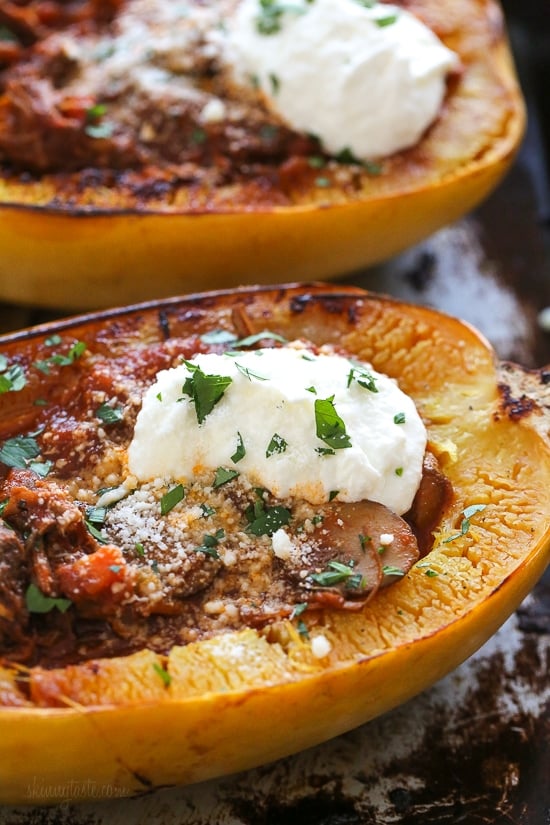 I swapped traditional pasta for roasted spaghetti squash to enjoy this cozy and delicious Beef and Mushroom Ragu served with a dollop of ricotta and grated Pecorino Romano – you won't miss the pasta!
