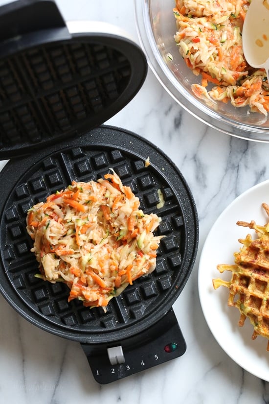 These veggie-packed latkes, are not your traditional latkes, they’re made with shredded potatoes, carrots, zucchini and bell pepper, and they are cooked in a waffle iron so there’s no need to fry! Top them with sour cream, lox and capers or with apple sauce on the side.
