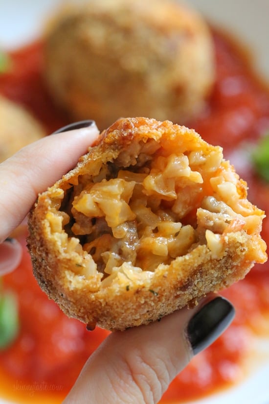 These Italian Cauliflower Rice Balls (Arancini) are made with cauliflower in place of rice! Lower in carbs and baked or made in the air fryer!