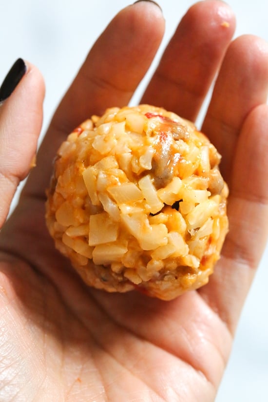 These Italian Cauliflower Rice Balls (Arancini) are made with cauliflower in place of rice! Lower in carbs and baked or made in the air fryer!