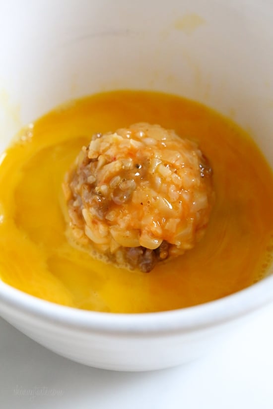 These Italian Cauliflower Rice Balls (Arancini) are made with cauliflower in place of rice! Lower in carbs and baked or made in the air fryer!