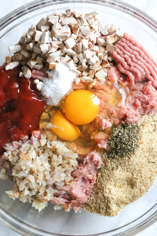 The best tasting, moist turkey meatloaf stuffed with cheddar cheese, spinach and rolled, jelly roll style topped with a ketchup based glaze. 