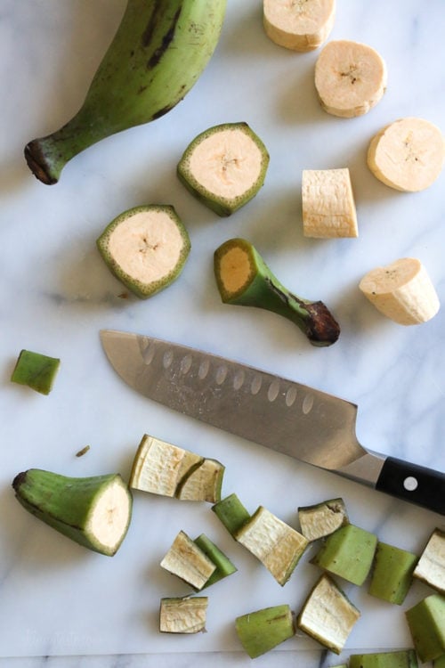 With a sharp knife cut a slit along the length of the plantain skin