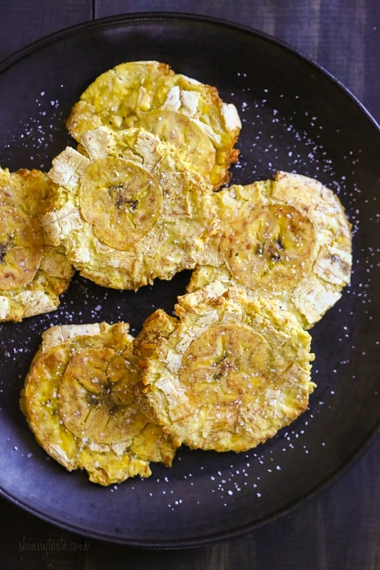 These easy tostones also known as patacones or fried green plantains are made healthier in the air fryer. No deep frying, just a few spritzes of olive oil for a crispy, delicious appetizer or side dish.